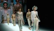 Models present creations from the Emporio Armani Spring/Summer 2022 collection during Milan Fashion Week in Milan, Italy, September 23, 2021. REUTERS/Alessandro Garofalo
