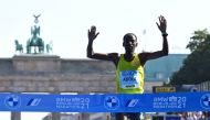 September 26, 2021 Ethiopia's Guye Adola celebrates after winning the elite men's race REUTERS/Annegret Hilse