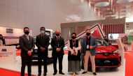 Officials pose for a group photo during the 3rd Majd Qatar Exhibition & Forum.