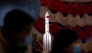 A model of the Long March-5 Y5 rocket from China's lunar exploration program Chang'e-5 Mission is displayed at an exhibition inside the National Museum in Beijing, China March 3, 2021. REUTERS/Tingshu Wang/File Photo