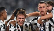 Juventus' Federico Chiesa celebrates scoring their first goal with teammates REUTERS/Massimo Pinca
