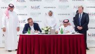 Sheikh Mansour bin Khalifa Al Thani (second right), Chairman of the Board of Directors of MBK Holding Group, and Badr El Din Wali (second left), Founder and Chairman of the Board of Directors of Vermeg International, signing the partnership agreement in D