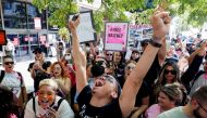 Supporters of pop star Britney Spears celebrate after a judge suspended the father of Britney Spears from his 13-years-long role as the controller of the singer's business affairs at Stanley Mosk Courthouse in Los Angeles, California, U.S., September 29, 