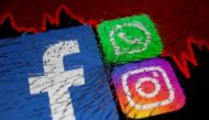 Facebook, Whatsapp and Instagram logos and stock graph are displayed through broken glass in this illustration taken October 4, 2021. REUTERS/Dado Ruvic/Illustration