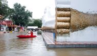 A lying Buddha statue is seen during the flood at a temple in Ayutthaya, Thailand, October 6, 2021. REUTERS/Soe Zeya Tun