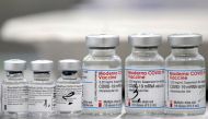 Vials of coronavirus disease (COVID-19) vaccines of Pfizer-BioNTech and Moderna are seen in the town of Ricany near Prague, Czech Republic, February 25, 2021. REUTERS/David W Cerny/File Photo