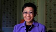 Maria Ressa, journalist and CEO of the Rappler news website, poses before a news conference to launch a commission to draft an 