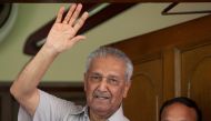 Pakistan nuclear scientist Abdul Qadeer Khan waves to journalists from the front door of his house in Islamabad, August 28, 2009. Reuters/Mian Khursheed/File Photo