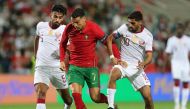Qatar captain Hassan Al Haydos (right) in action during the match on Saturday.