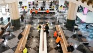 Diners sit to eat at a city centre food court on the first day of eased restrictions for vaccinated patrons in Sydney, Australia, October 11, 2021. Reuters/Loren Elliott