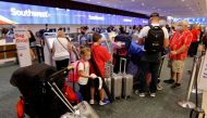 Passengers check in for a Southwest Airlines flight at Orlando International Airport in Orlando, Florida, U.S., October 11, 2021. REUTERS/Joe Skipper
