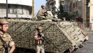 Army soldiers patrol after gunfire erupted, in Beirut, Lebanon October 14, 2021. REUTERS/Mohamed Azakir
