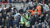 Newcastle fan in the stand is given emergency medical help Action Images via Reuters/Lee Smith