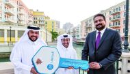 QIB’s grand prize winner Nasser Al Kuwari receives the key for his new apartment at The Pearl-Qatar.  