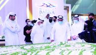 Abdullah bin Jubara Al Rumaihi (second left), CEO of Barwa Real Estate Group, with other officials, at Barwa's pavilion, during Cityscape Qatar 2021. 
