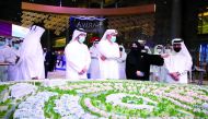 Former Prime Minister H E Sheikh Hamad bin Jassim bin Jaber Al Thani (centre), with other officials during a tour of Barwa’s pavilion during Cityscape Qatar 2021. 