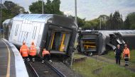 A derailed passenger train is seen after it hit a car on a level crossing in Kembla Grange, Australia, October 20, 2021. AAP Image/Dean Lewins via REUTERS