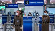 Immigration police officers are seen during a readiness inspection in preparation for the country's reopening on November 1, at Suvarnabhumi International Airport in Bangkok, Thailand, October 20, 2021. REUTERS/Athit Perawongmetha
