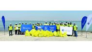 Doha Bank staff during the beach clean-up drive held recently in collaboration with the Ministry of Municipality. 