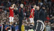 Manchester United's Edinson Cavani and Diogo Dalot get ready to come on as substitutes as manager Ole Gunnar Solskjaer looks on REUTERS/Phil Noble 