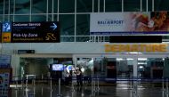 People are seen at Ngurah Rai International Airport ahead of the reopening of Indonesia's resort island of Bali on Thursday, in Badung, Bali, Indonesia October 13, 2021. Antara Foto/Fikri Yusuf/via Reuters