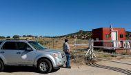 FILE PHOTO: A compliance officer from the State of New Mexico waits to enter Bonanza Creek Ranch where on the film set of 