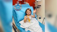 Cleo Smith, 4, who went missing from an Australian outback campsite more than two weeks ago and was found in a locked house on November 3, smiles from a hospital bed in Carnarvon, Australia, in this handout photo released to Reuters on November 3, 2021. Mandatory credit WESTERN AUSTRALIA POLICE FORCE/Handout via REUTERS