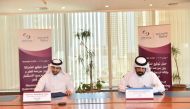 Sheikh Ali Alwaleed Al Thani, CEO, IPA Qatar, and Rashid bin Ali Al Mansoori, CEO of QSE, signing the MoU during a ceremony held at Qatar Stock Exchange headquarters.