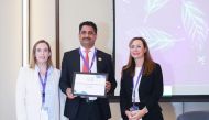 Saifullah Khan (centre), CFO at Baladna, receives the company's awards at the 2021 MEIRA IR Awards, recently.
