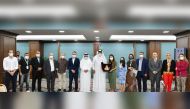Qatar Chamber (QC) First Vice-Chairman Mohamed bin Ahmed bin Towar Al Kuwari (eighth right), QC Board Member Mohamed bin Ahmed Al Obaidly (seventh left), with delegates of the Brazilian trade mission led by the Arab Brazilian Chamber of Commerce’s Business Director Daniella Ribeiro Leite (seventh right) at the Chamber’s headquarters, yesterday. 