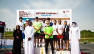 Winners of the team relay with officials during the presentation ceremony.