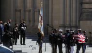 Alma Powell, wife of late former U.S. Secretary of State Colin Powell, walks behind his casket as it is carried out after the memorial service at Washington National Cathedral in Washington, DC, U.S. November 5, 2021. REUTERS/Leah Millis