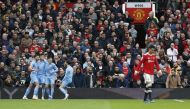 Manchester City's Ruben Dias, Joao Cancelo, Phil Foden and Bernardo Silva celebrate after Manchester United's Eric Bailly scores an own goal and Manchester City's first REUTERS/Craig Brough