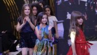 Children participate in the 'Fashion Festival' at Doha Festival City.  