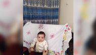 Sohail Ahmadi, around two-months-old, is seen in this handout picture taken August 2021 in Kabul, Afghanistan. Sohail's parents Mirza Ali and his wife Suraya handed him over the fence to a U.S. soldier on August 19, 2021 in the chaos following the U.S. troop withdrawal and hasty evacuation at the Kabul Airport. But by the time the family got to the other side of the fence, the baby was no where to be found. Courtesy of the Ahmadi family/Handout via REUTERS