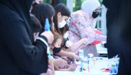 Families participate in the QCRI's 'Mother-Child Tech Fun' activities.