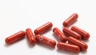 An experimental COVID-19 treatment pill, called molnupiravir and being developed by Merck & Co Inc and Ridgeback Biotherapeutics LP, is seen in this undated handout photo released by Merck & Co Inc and obtained by Reuters on October 26, 2021. Merck & Co Inc/Handout via REUTERS/File Photo