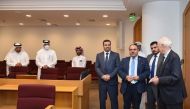 Iraq’s Minister of Justice H E Salar Abdul Sattar Muhammad with officials from Qatar International Court and Dispute Resolution Centre in Doha, yesterday.