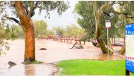 General view of the swelling Todd River in Alice Springs, Australia's Northern Territory, Australia, November 10, 2021, in this still image taken from video provided on social media. Alice Woods/via Reuters 