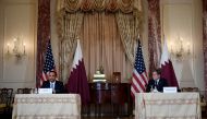 US Secretary of State Antony Blinken (R) and Qatar's Foreign Minister Sheikh Mohammed bin Abdulrahman Al Thani (L) hold a news conference following a US-Qatar Strategic Dialogue signing ceremony at the State Department in Washington, DC on November 12 , 2021. Olivier Douliery/Pool via REUTERS?