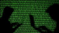 FILE PHOTO: Silhouettes of laptop users are seen next to a screen projection of binary code are seen in this picture illustration taken March 28, 2018. REUTERS/Dado Ruvic/Illustration/File Photo
