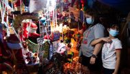 People shop for decorations at a store in Quezon City, Metro Manila, Philippines, November 14, 2021. Reuters/Lisa Marie David