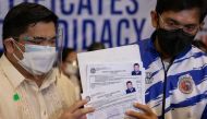 Representatives of Philippine President Rodrigo Duterte file his certificate of candidacy for senator after withdrawing his certificate of candidacy for vice president, in the 2022 national election, at the Commission on Elections, in Manila, Philippines, November 15, 2021. REUTERS/Eloisa Lopez