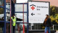 A woman walks to a coronavirus disease (COVID-19) vaccination center at 