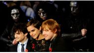 FILE PHOTO: Britain's Emma Watson poses with Daniel Radcliffe (L) and Rupert Grint pose as they arrive for the world premiere of 