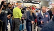 People gather to leave Hartsfield-Jackson Atlanta International Airport after reported shooting, in Atlanta, Georgia, U.S., November 20, 2021, in this still image obtained from a social media video. Twitter/mohiterajas/via Reuters
