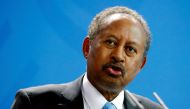 FILE PHOTO: Sudan's Prime Minister Abdalla Hamdok and German Chancellor Angela Merkel (not pictured) address the media at the Chancellery in Berlin, Germany, February 14, 2020. REUTERS/Hannibal Hanschke/File Photo