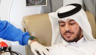 A student donating blood at Qatar University. 