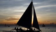 Tourists watch sunset aboard sailboats, one day before the temporary closure of the holiday island Boracay, in the Philippines April 25, 2018. REUTERS/Erik De Castro/File Photo