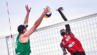 Qatar's Cherif Younousse in action against Australia’s Christopher McHugh and Paul Burnett in the semi-finals of the Asian Beach Volleyball Championships in Phuket, Thailand, yesterday.